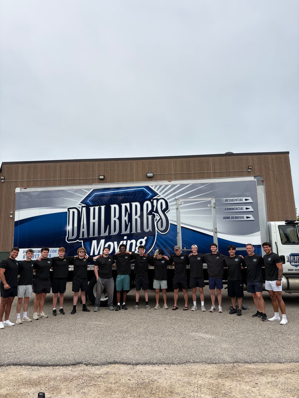 Professional movers handling household furniture with care